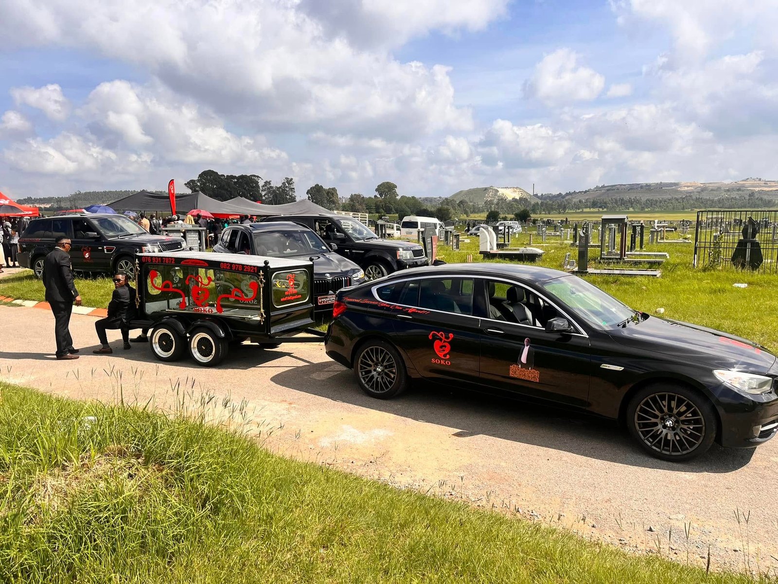 Soko hearse and black family vehicles
