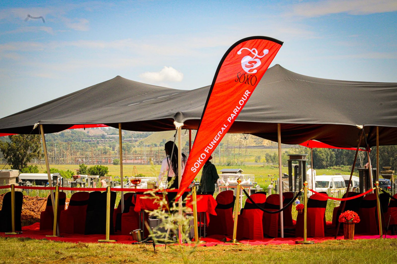 Soko red and black funeral seating and tent setup