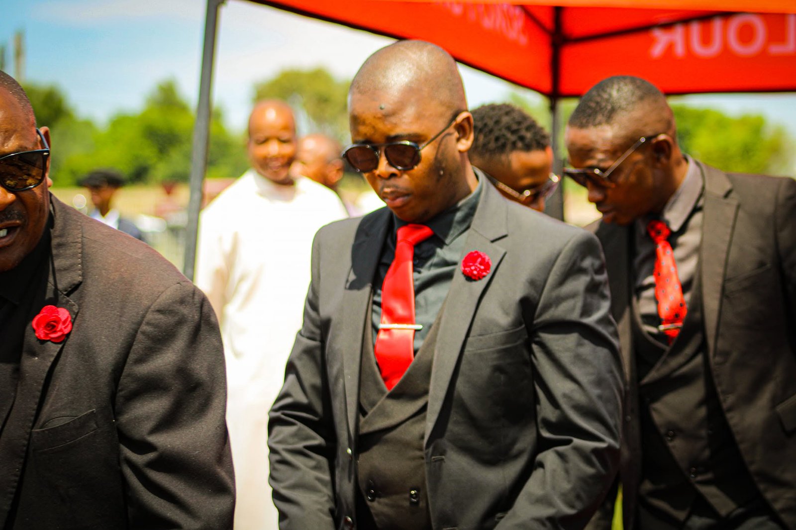 Soko team members in black suits and red ties